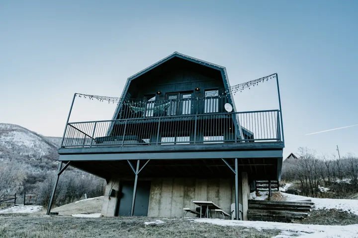 View of front of home with a deck with mountain view