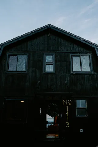 View of side of property featuring a porch