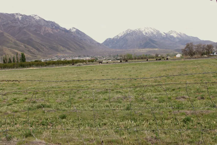 View of mountain backdrop featuring rural landscape
