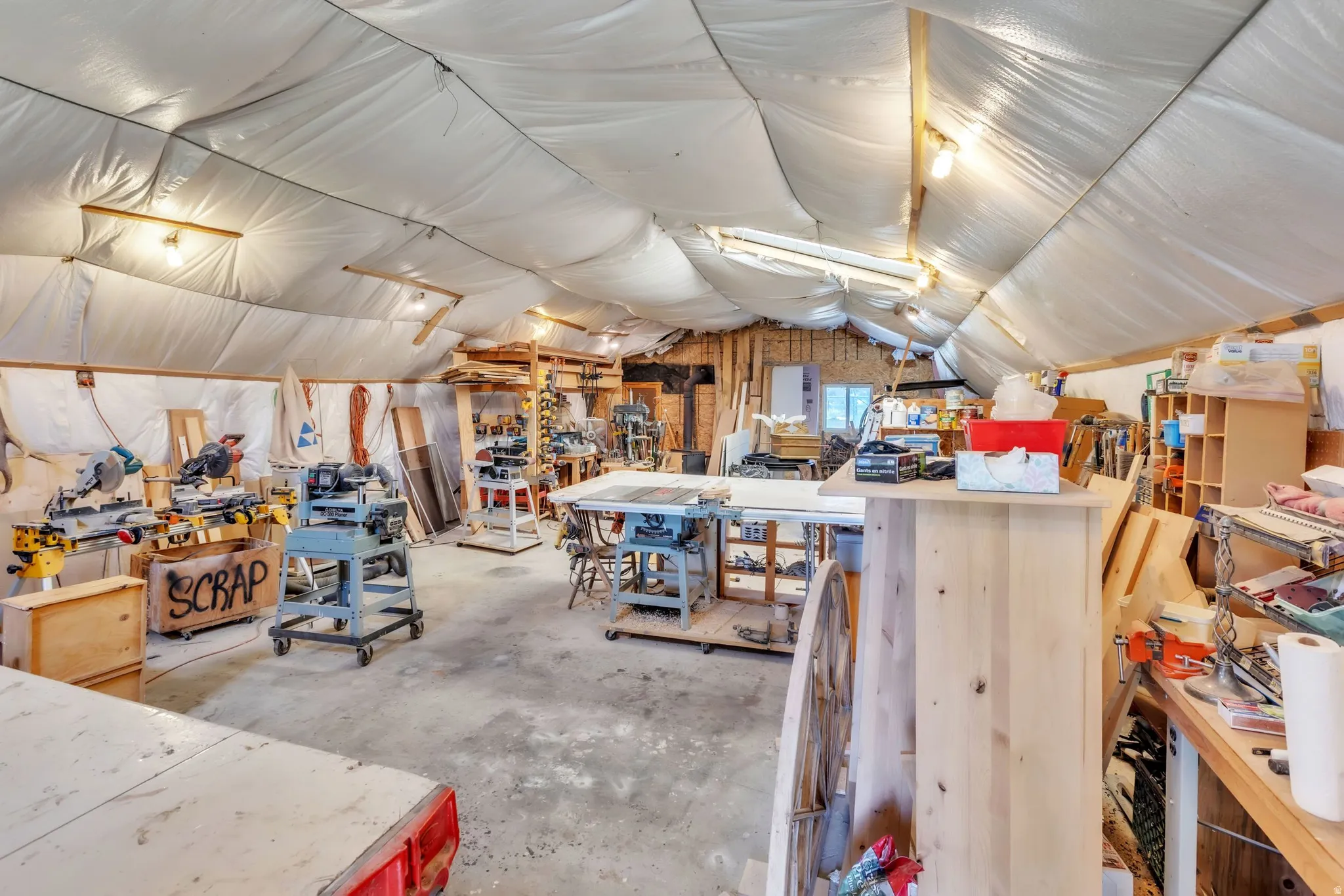 Misc room featuring a workshop area and vaulted ceiling