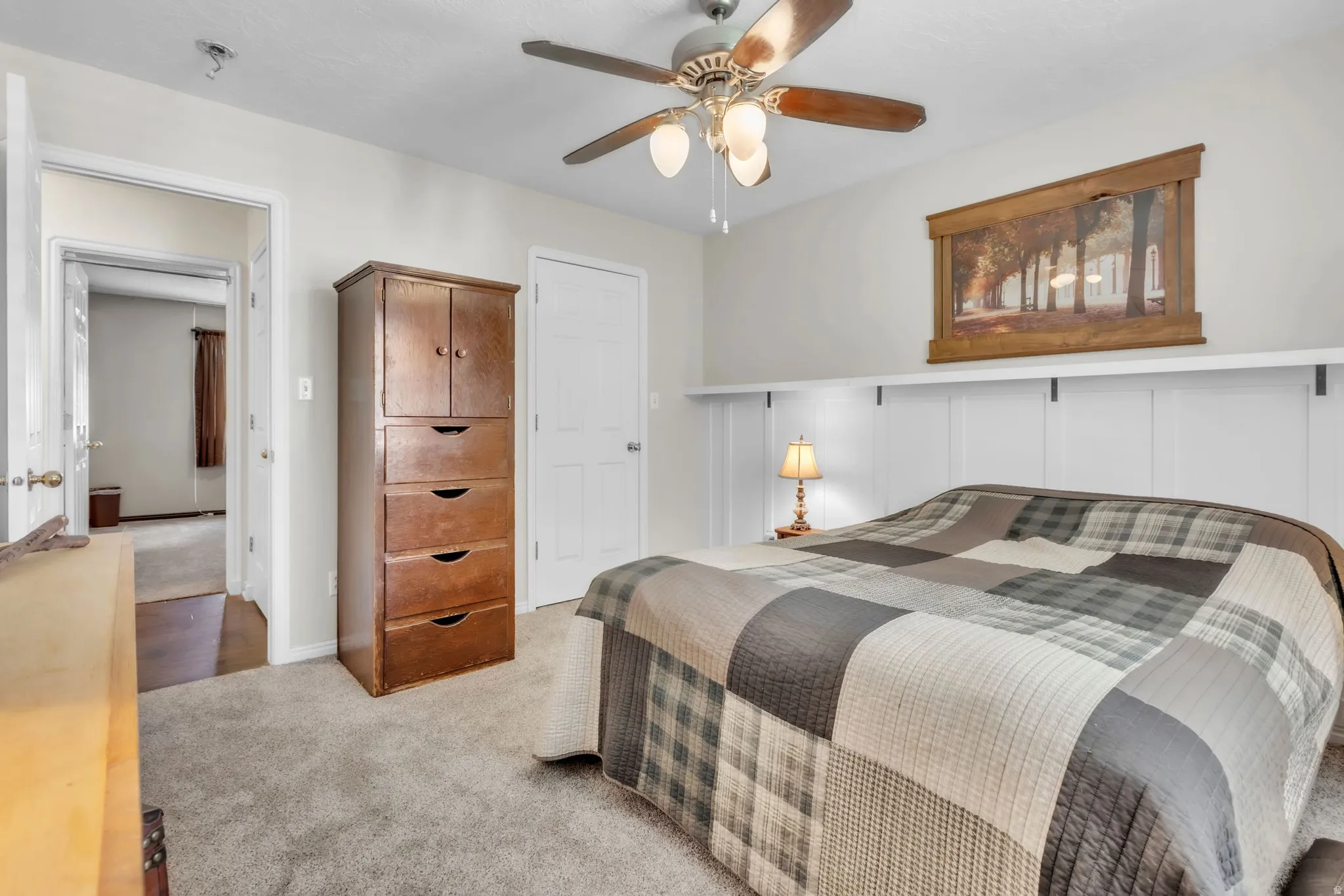 Bedroom with carpet flooring and a ceiling fan