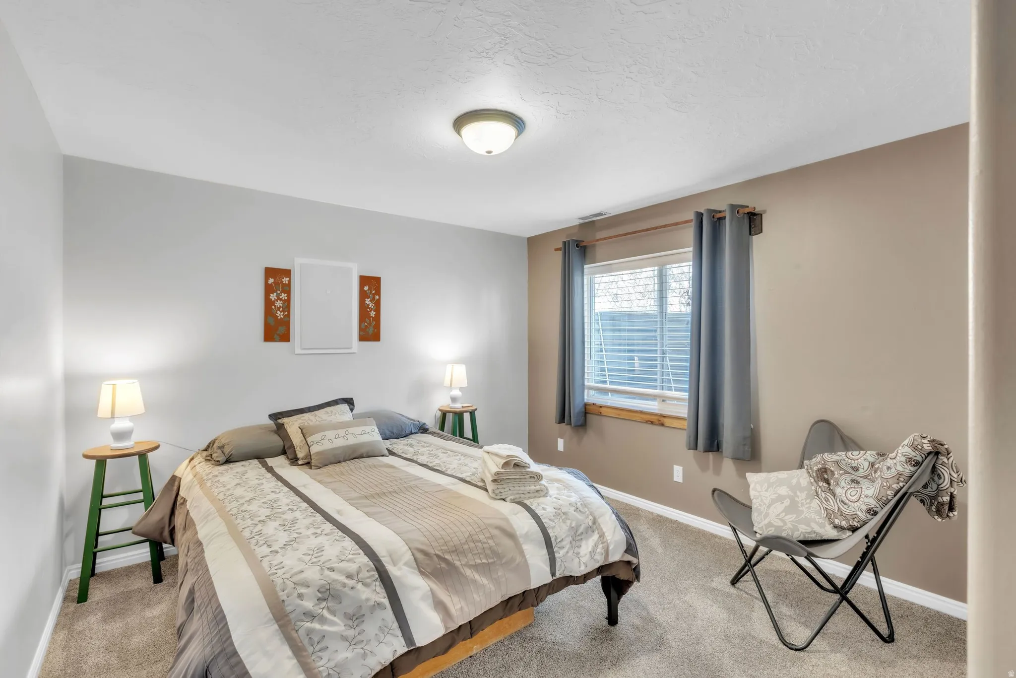 Carpeted bedroom featuring baseboards