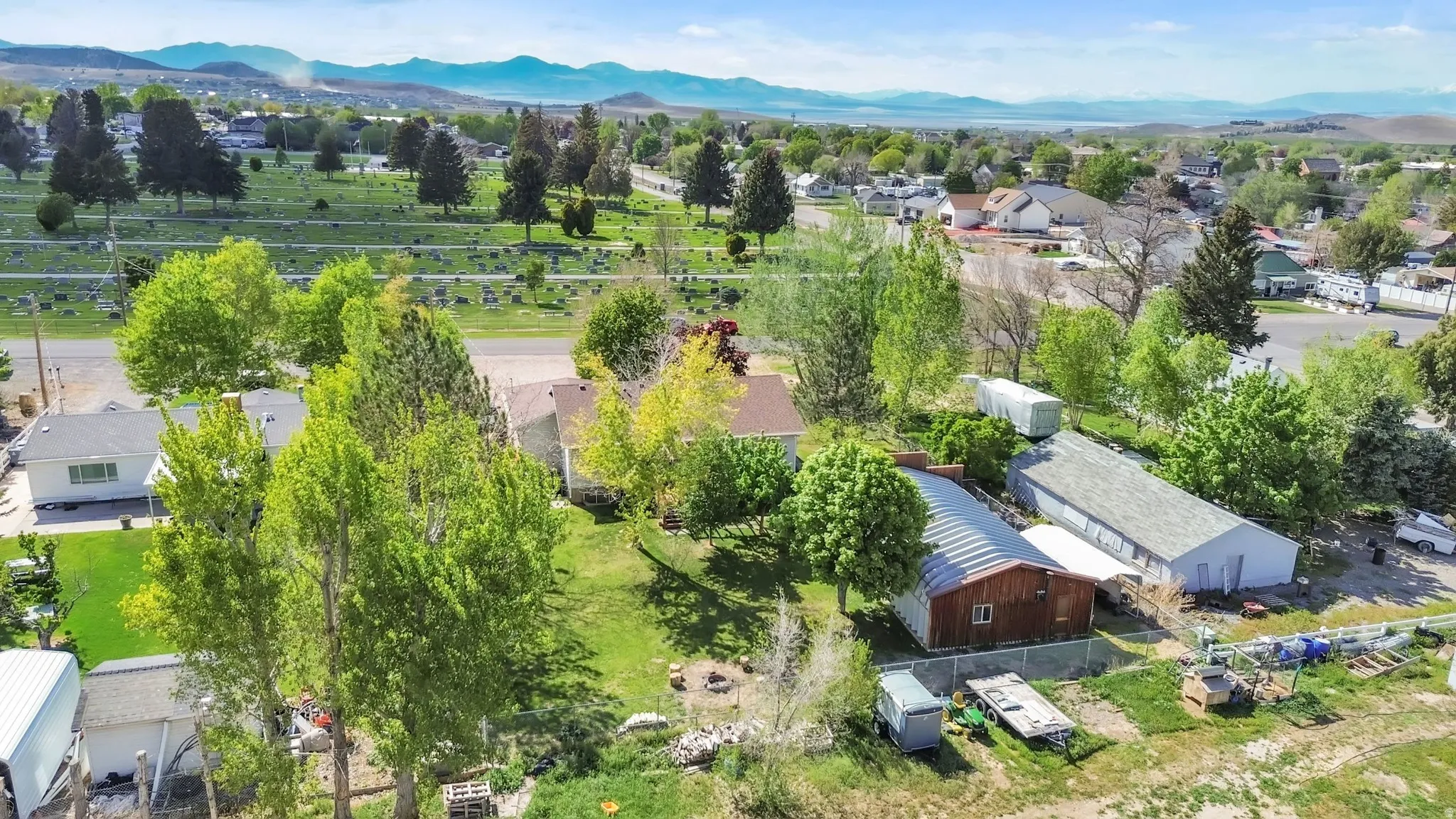 Aerial perspective of suburban area with a mountain backdrop