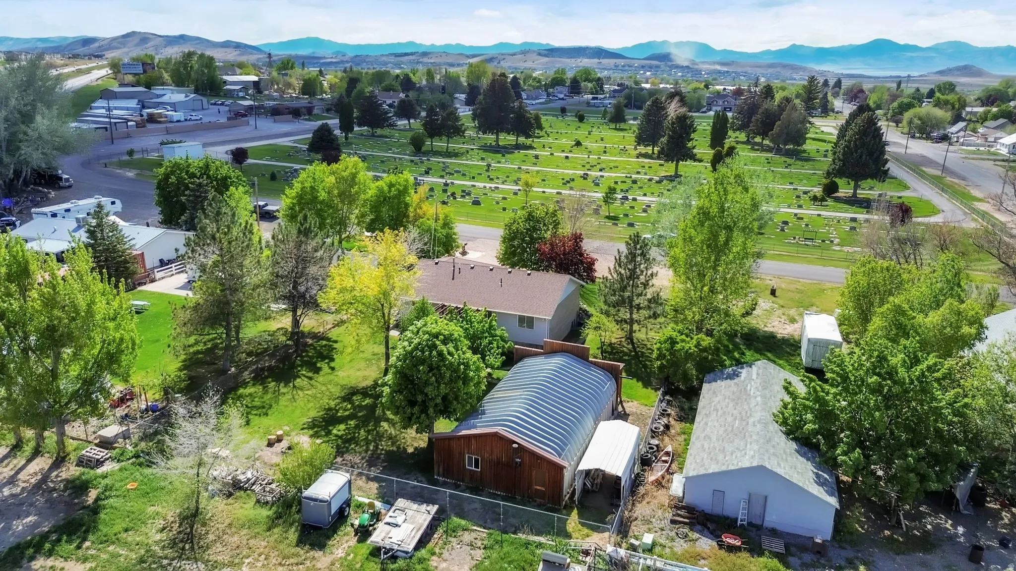 Aerial perspective of suburban area with a mountain backdrop