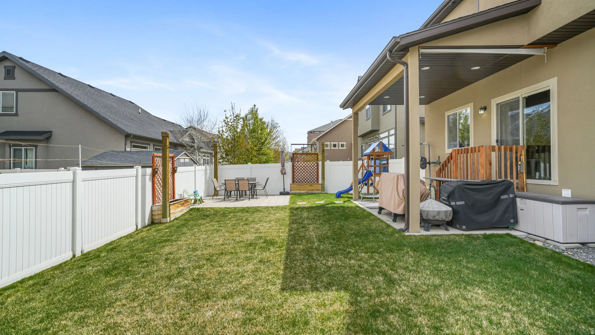 Fenced backyard featuring and a patio area