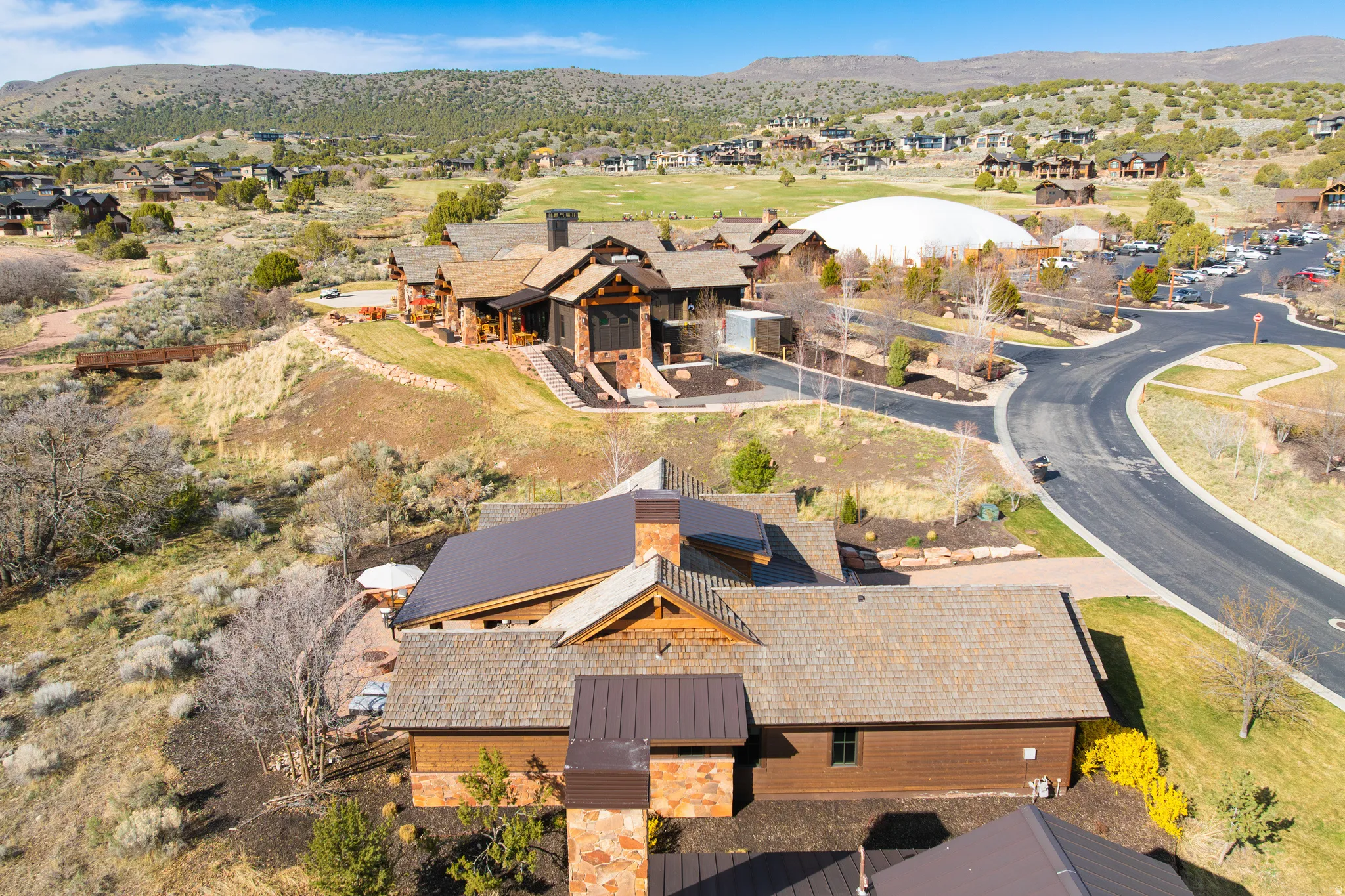 Aerial view of residential area featuring a mountain backdrop