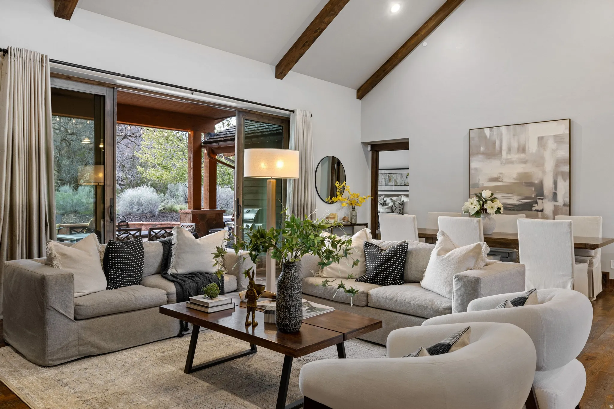 Living room featuring wood finished floors and vaulted ceiling