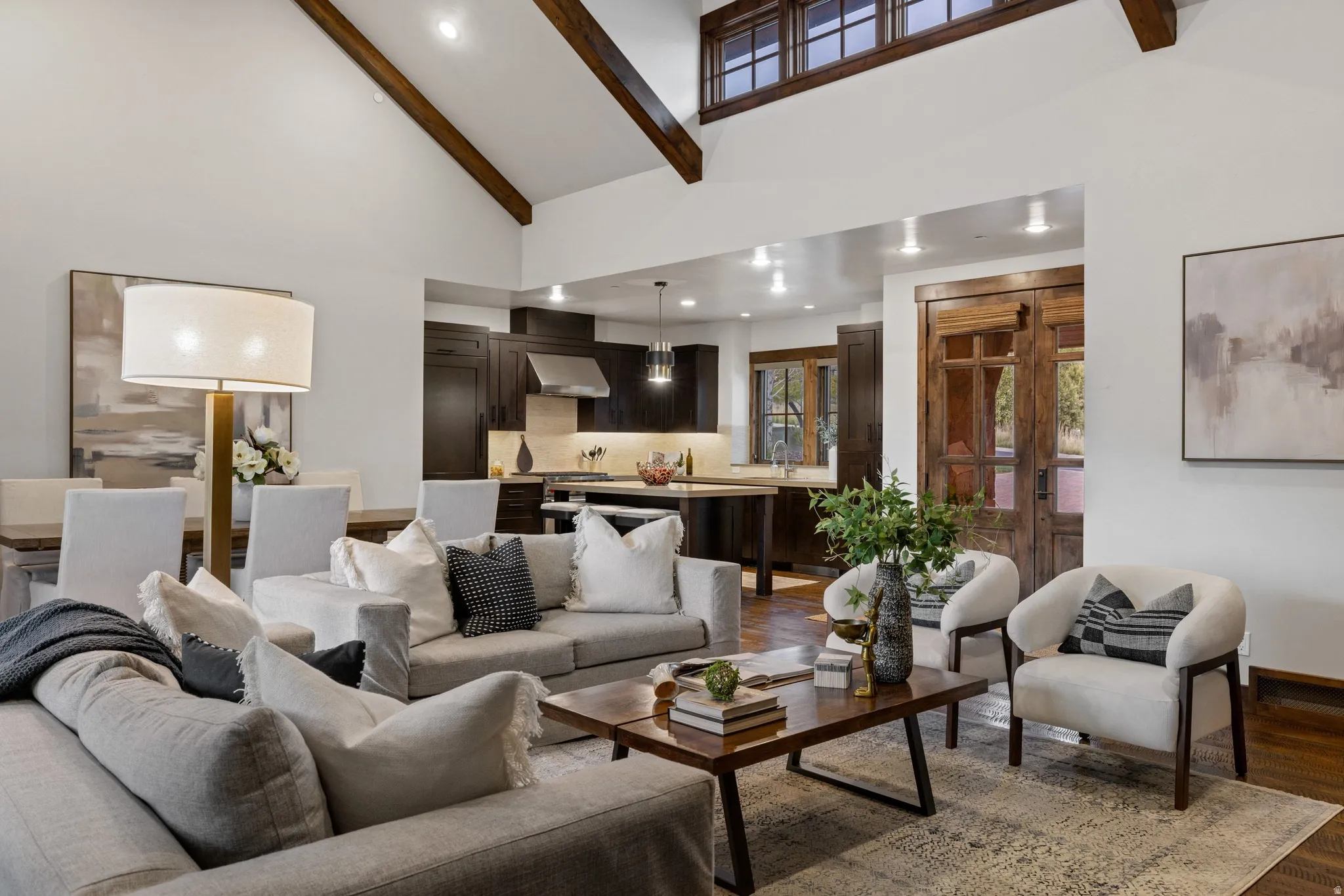 Living room featuring recessed lighting, wood finished floors, and lofted ceiling