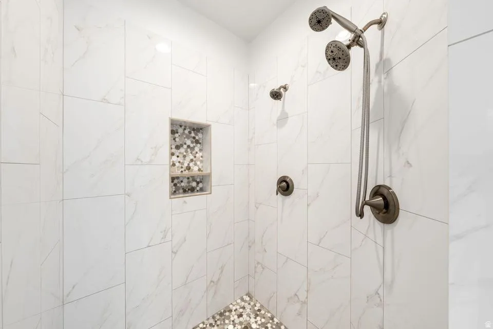Full bathroom with a tile shower