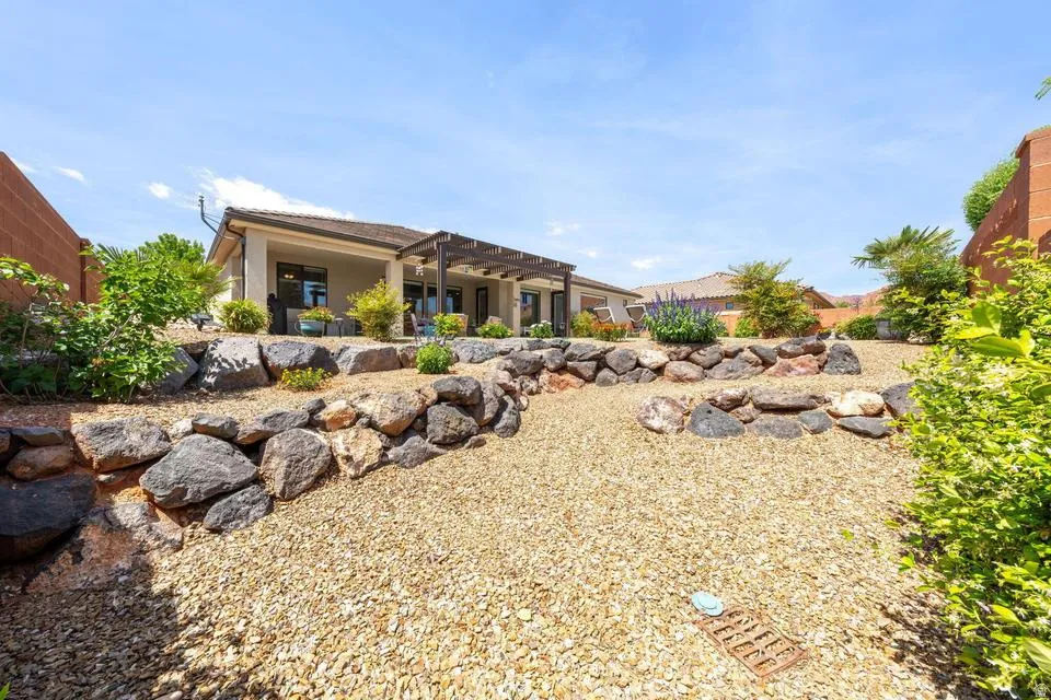 Rear view of property featuring stucco siding