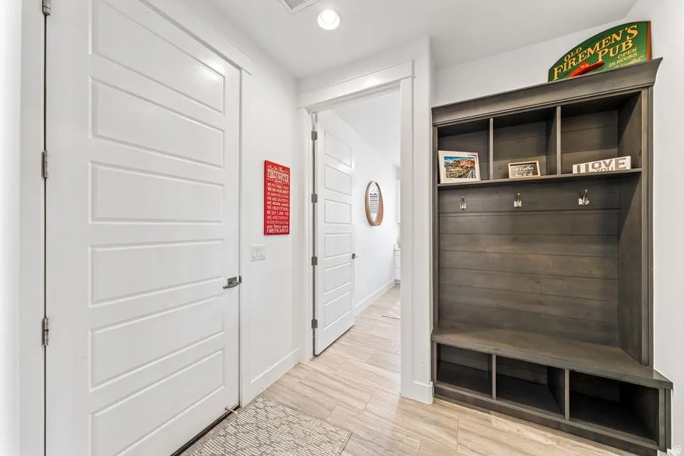 Mudroom with recessed lighting and light wood finished floors