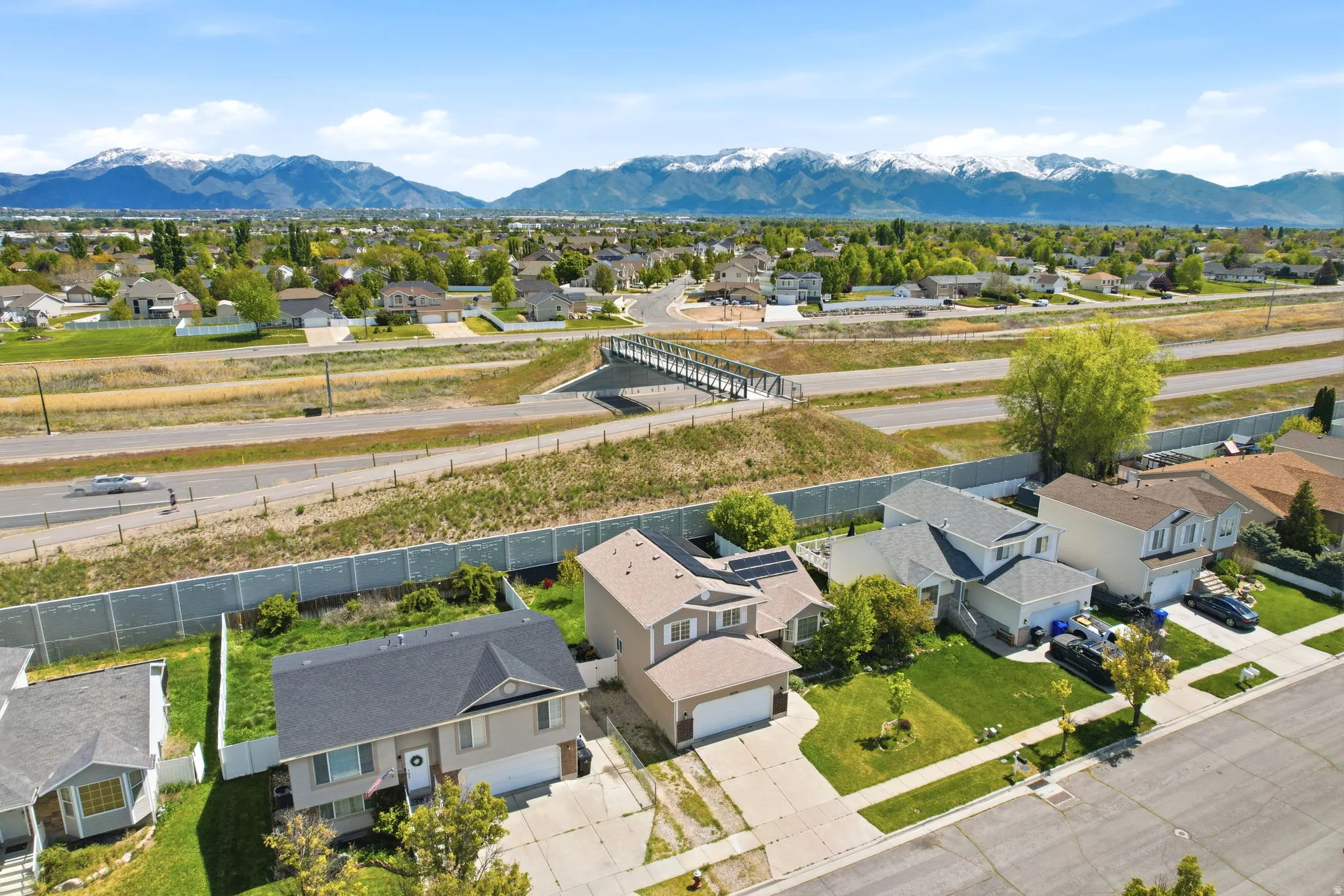 Aerial view of residential area featuring a mountainous background
