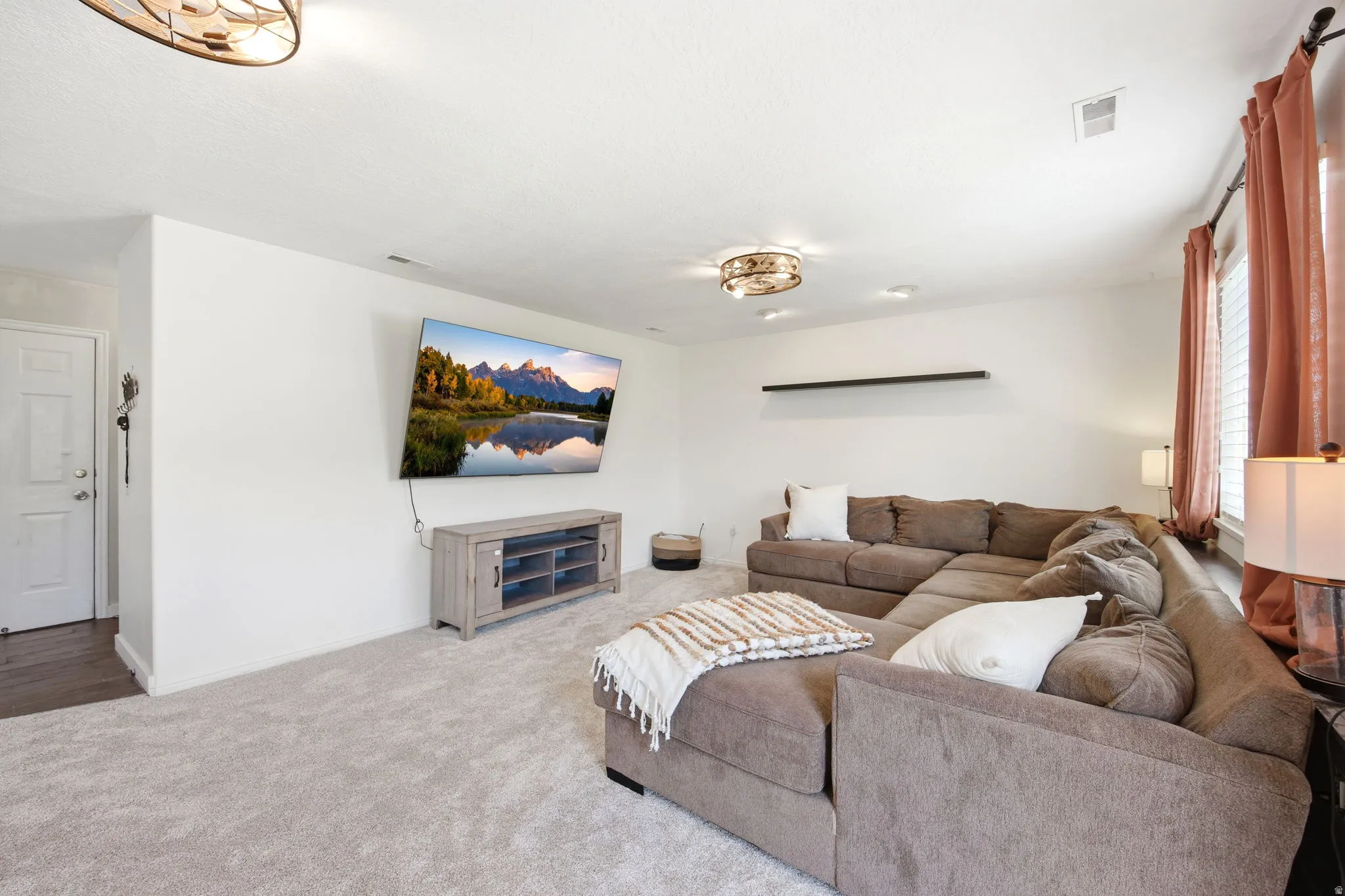 Living area with carpet floors and baseboards