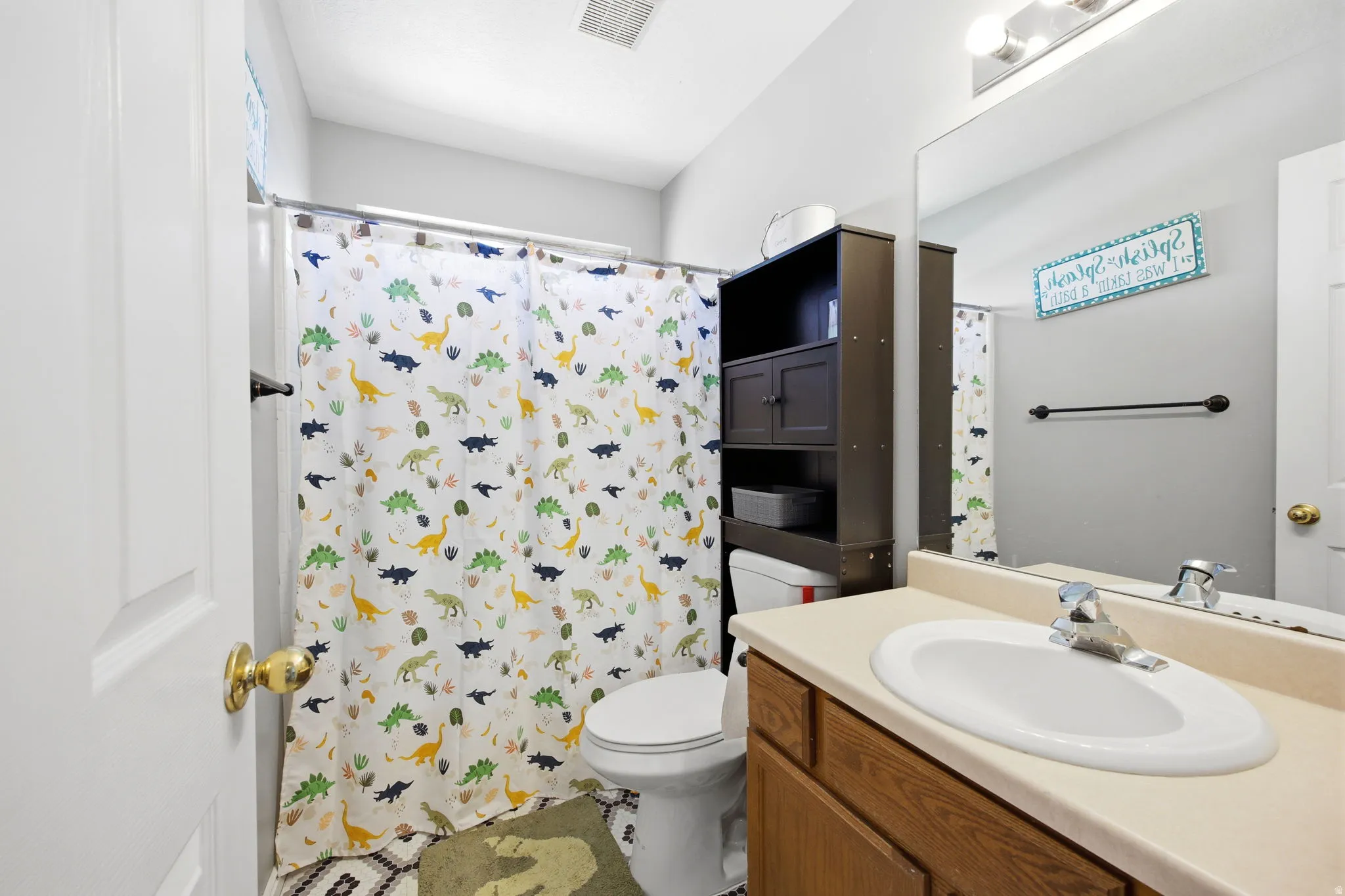 Full bath featuring vanity and a shower with curtain