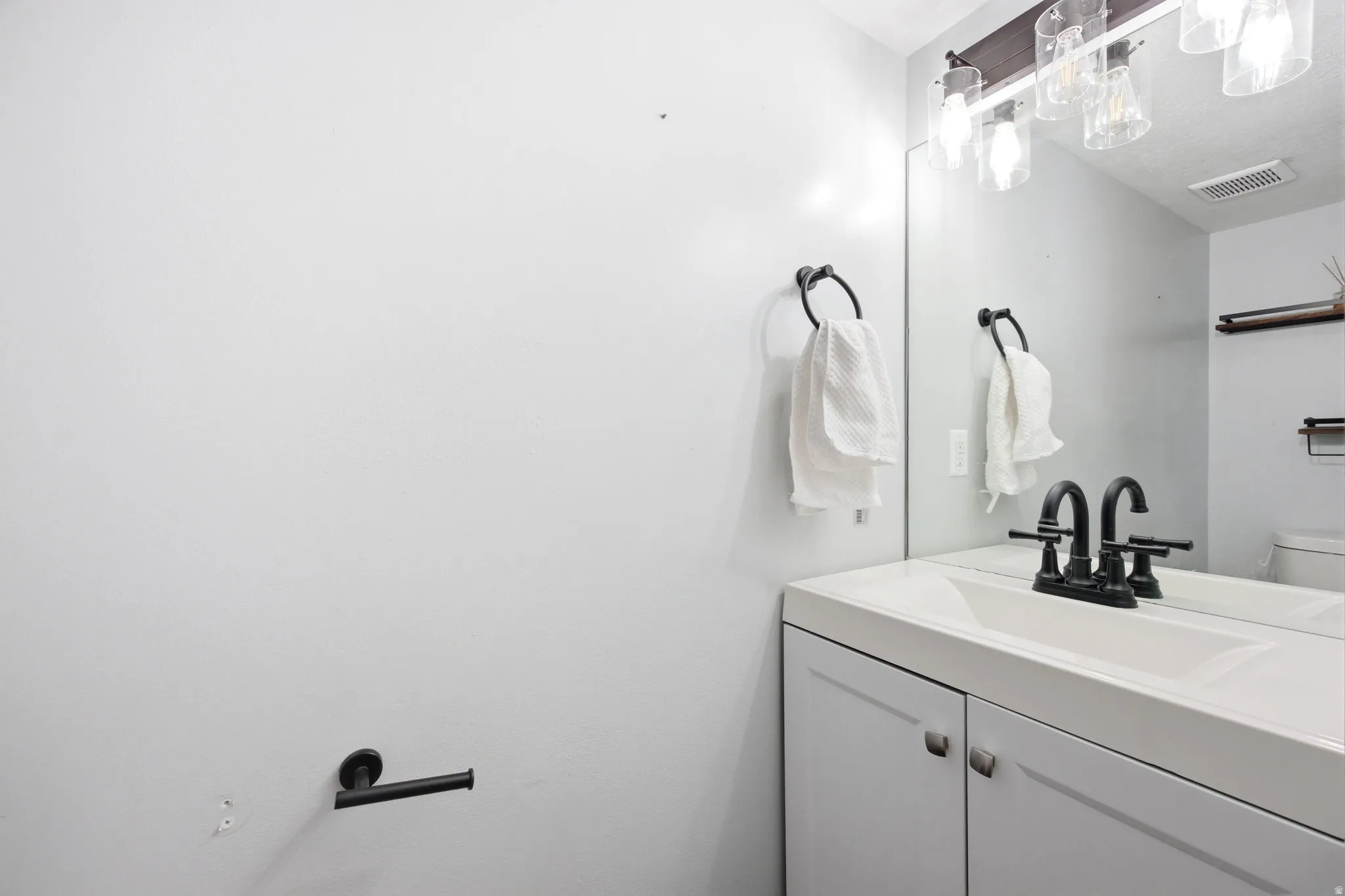 Bathroom with vanity and toilet