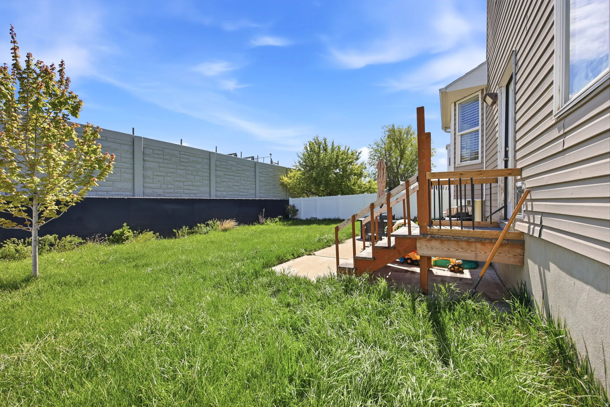 Fenced yard with a patio area