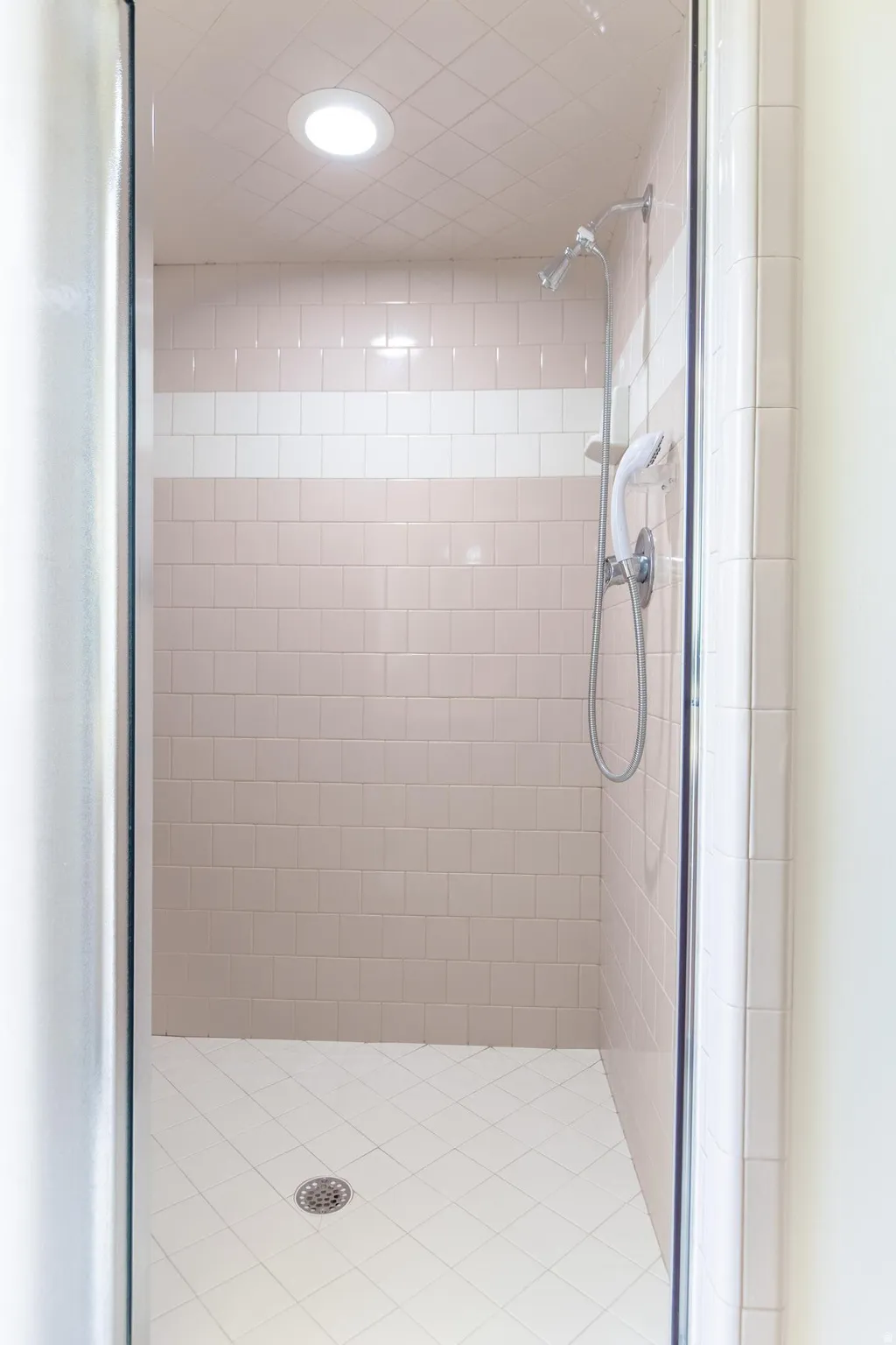 Full bathroom featuring a stall shower and recessed lighting