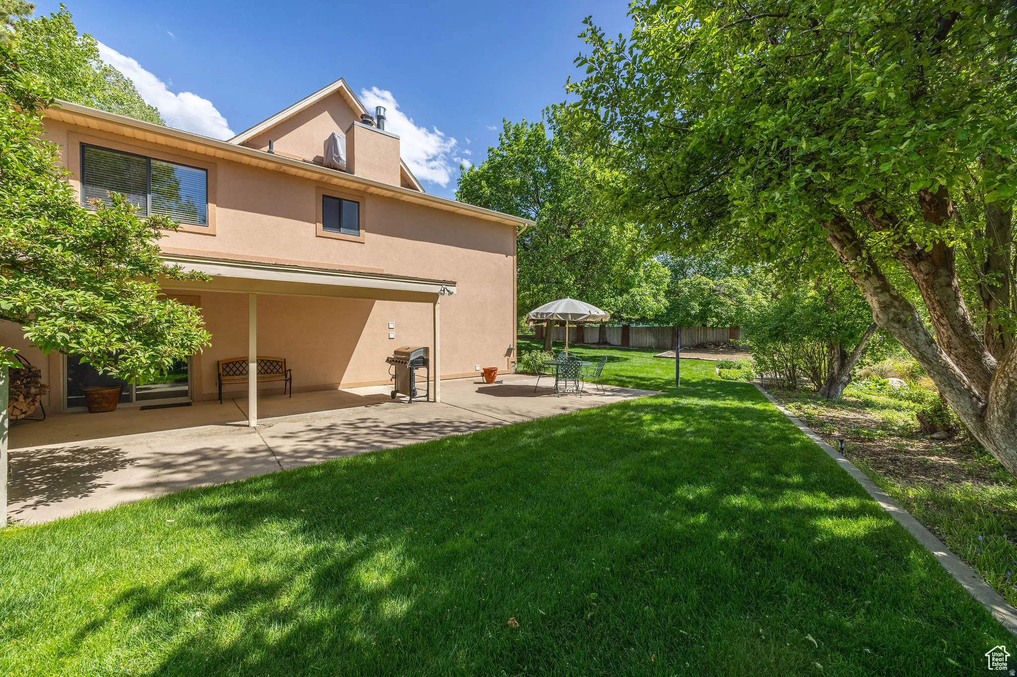 View of yard with a patio