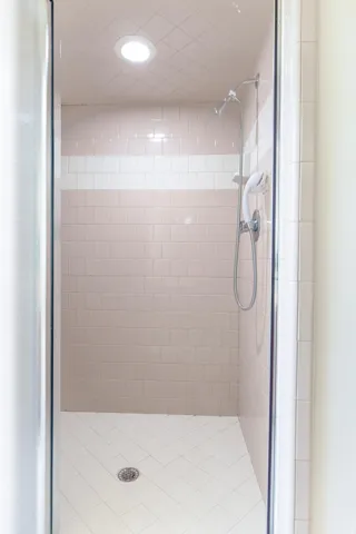 Full bathroom featuring a stall shower and recessed lighting