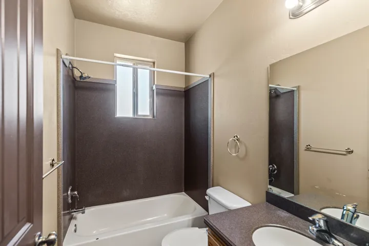 Full bathroom featuring vanity and  shower combination