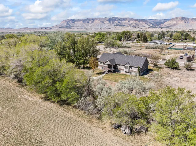 View from above of property with a mountain backdrop