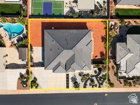 Aerial view of property and surrounding area featuring property parcel outlined