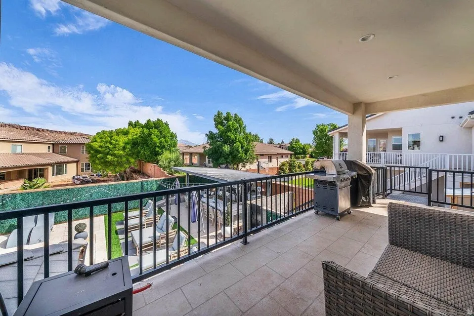 Balcony featuring a residential view and a grill