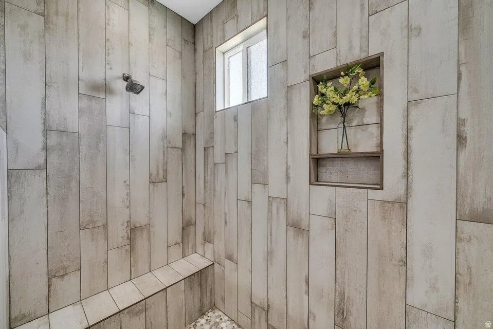 Bathroom featuring a tile shower