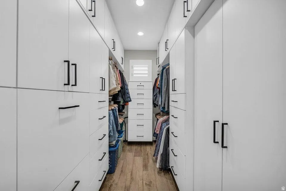 Walk in closet featuring light wood finished floors