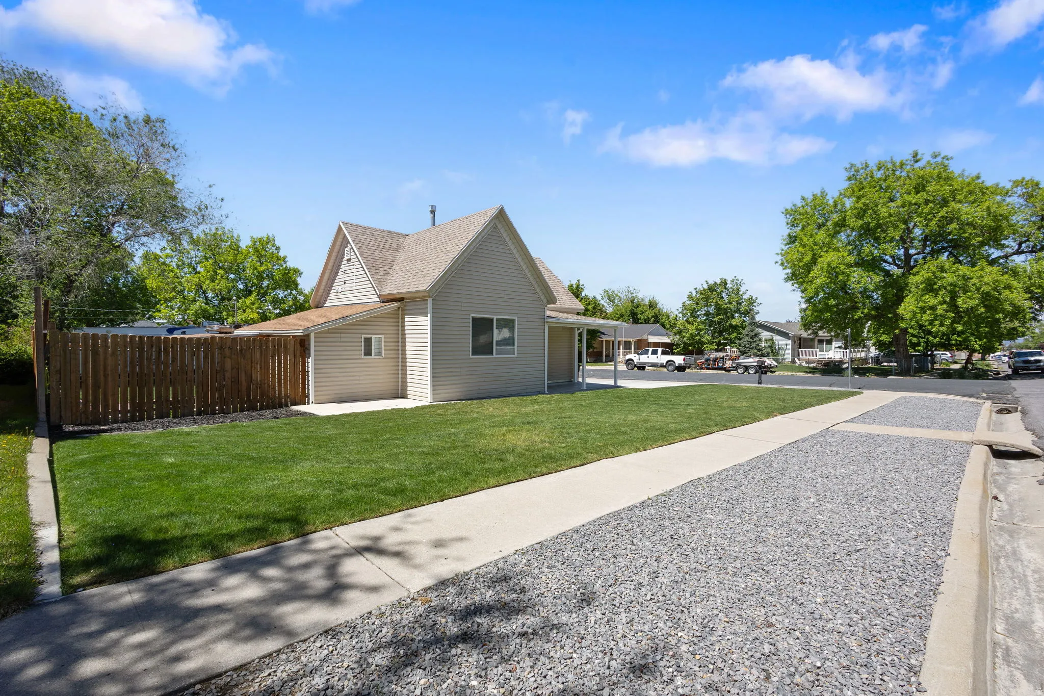 View of side of home with roof with shingles