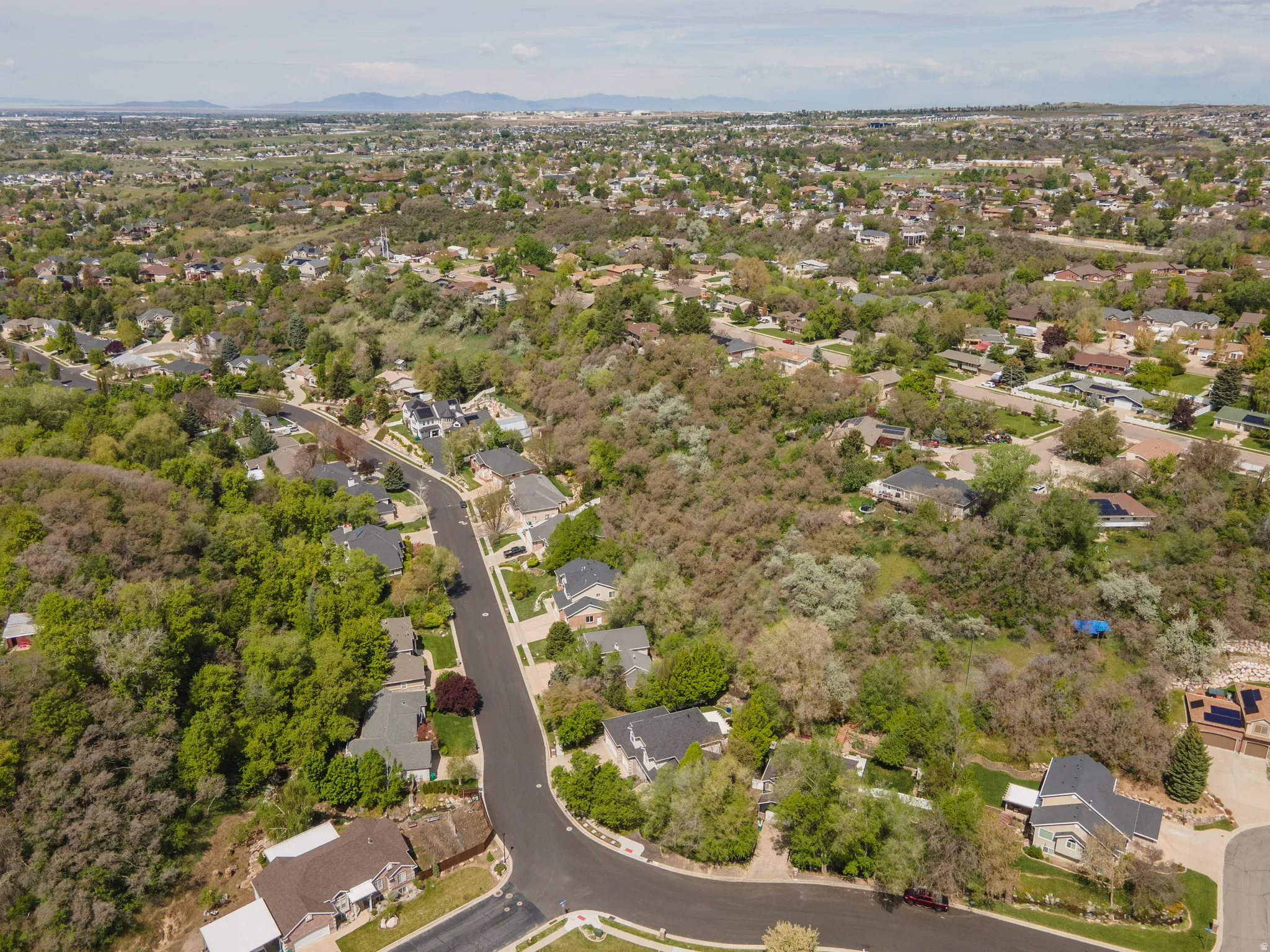 View of property location with nearby suburban area and a mountainous background