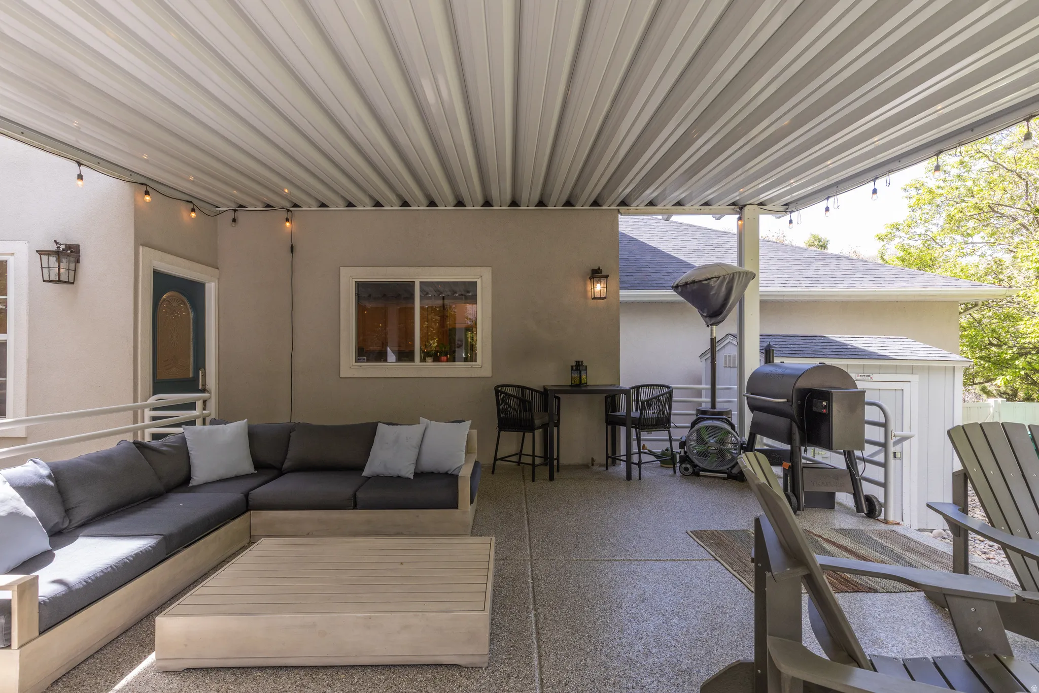 View of covered patio with outdoor seating