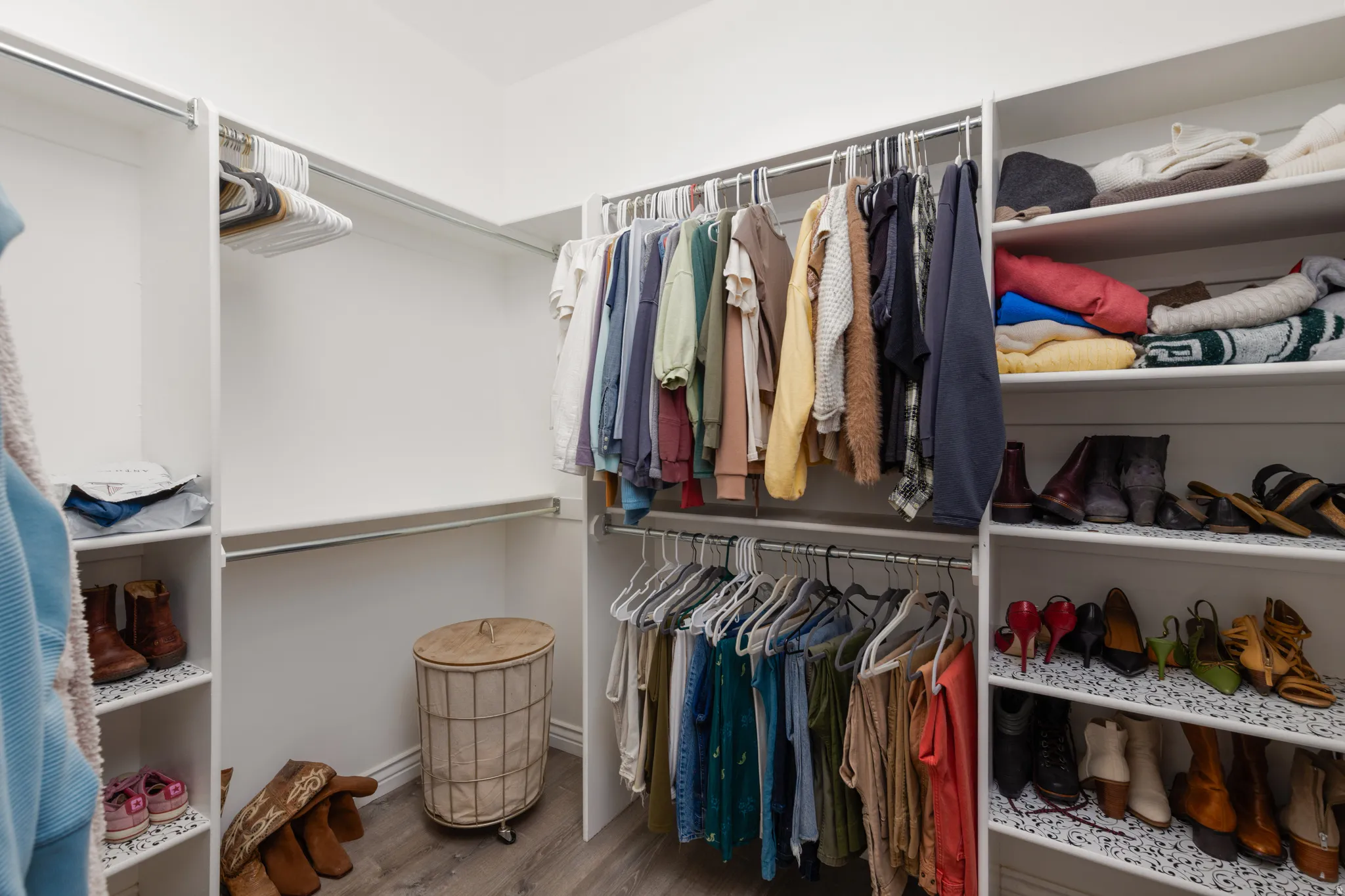 Walk in closet featuring wood finished floors