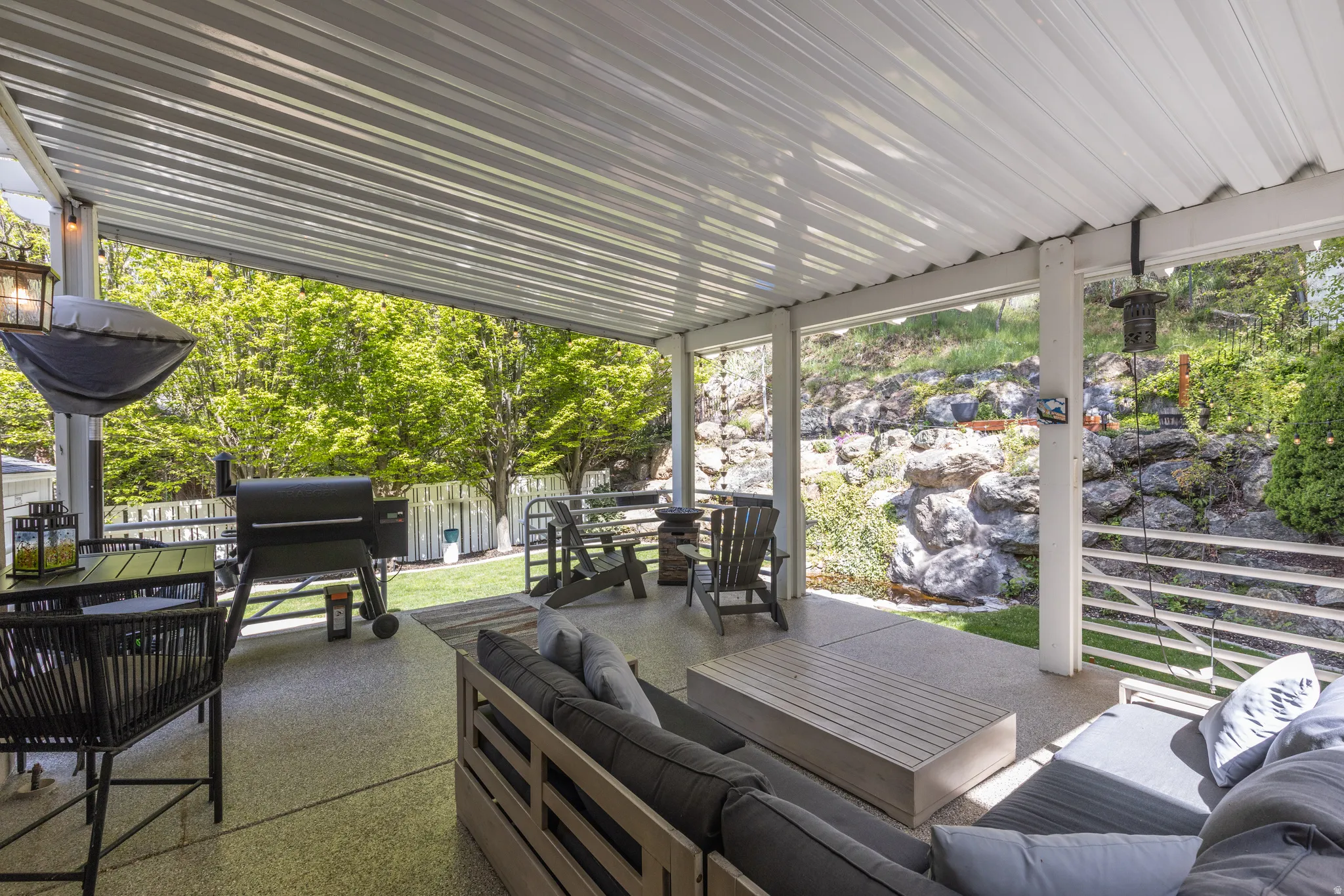 View of patio featuring outdoor lounge area and a grill