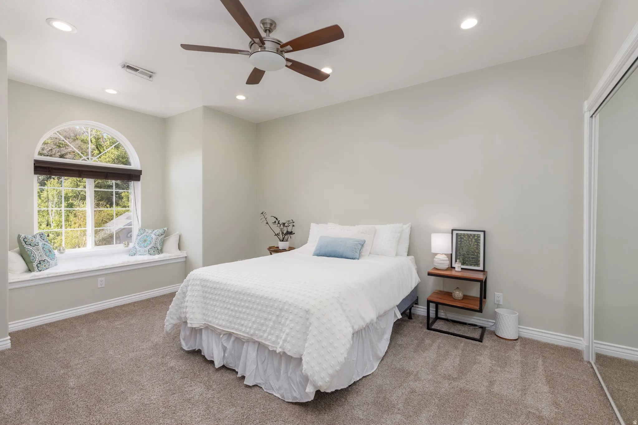 Carpeted bedroom featuring recessed lighting, a ceiling fan, and a closet
