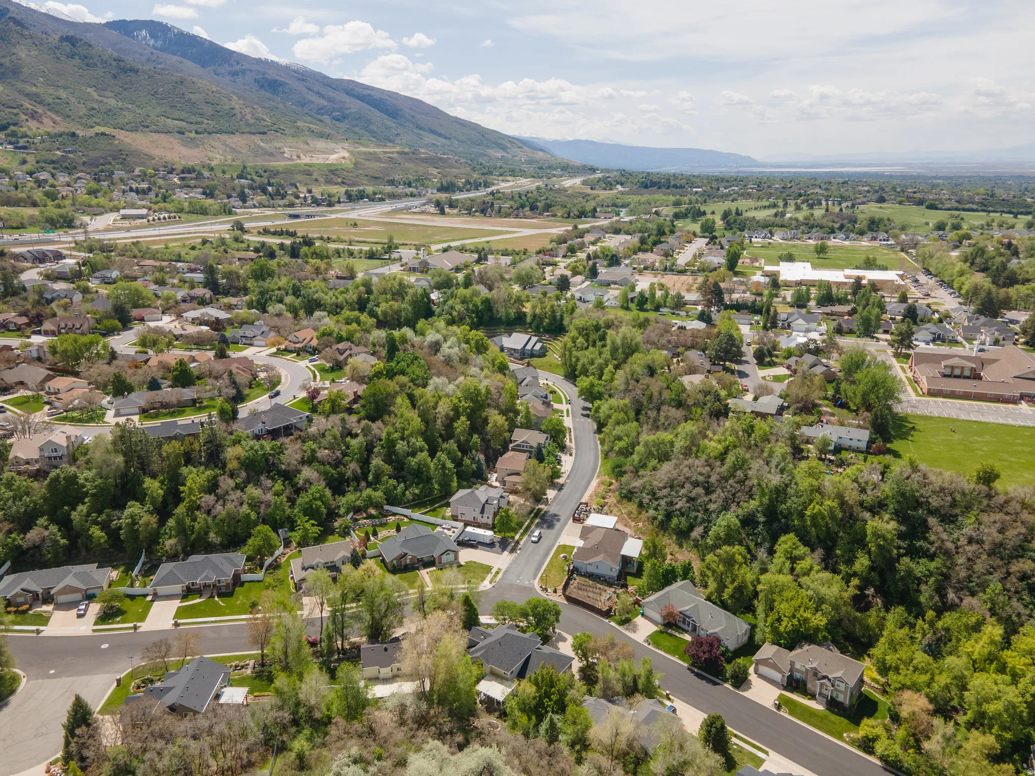 Aerial view of residential area with a mountain backdrop
