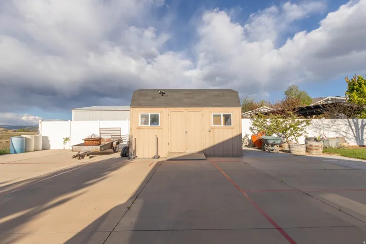 View of shed featuring a fire pit