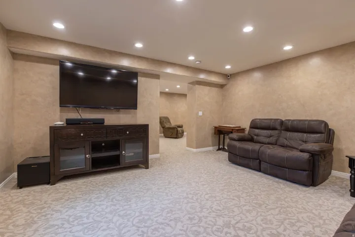 Living room with recessed lighting and light colored carpet