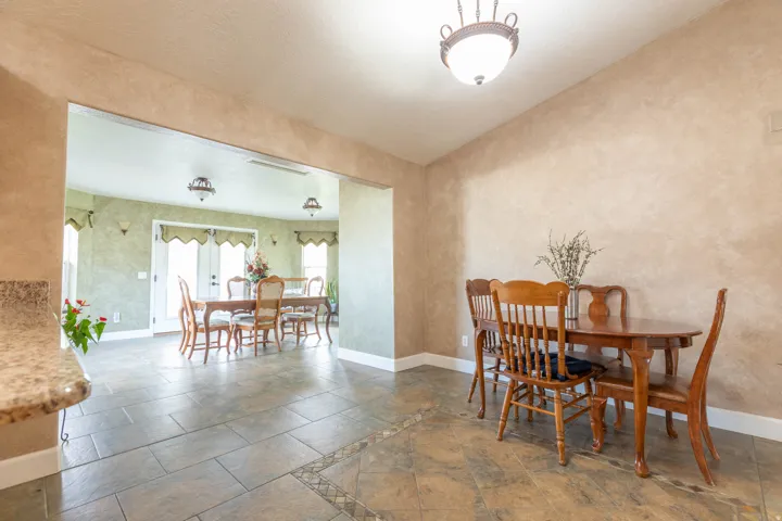 Dining room with baseboards and stone finish flooring