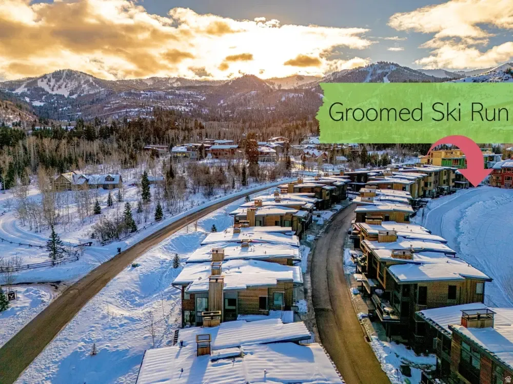 Snowy aerial view featuring a mountain view