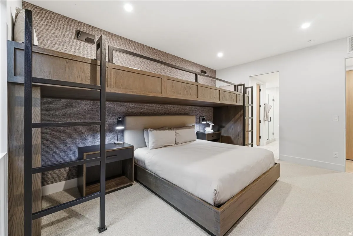 Bedroom with light carpet and recessed lighting