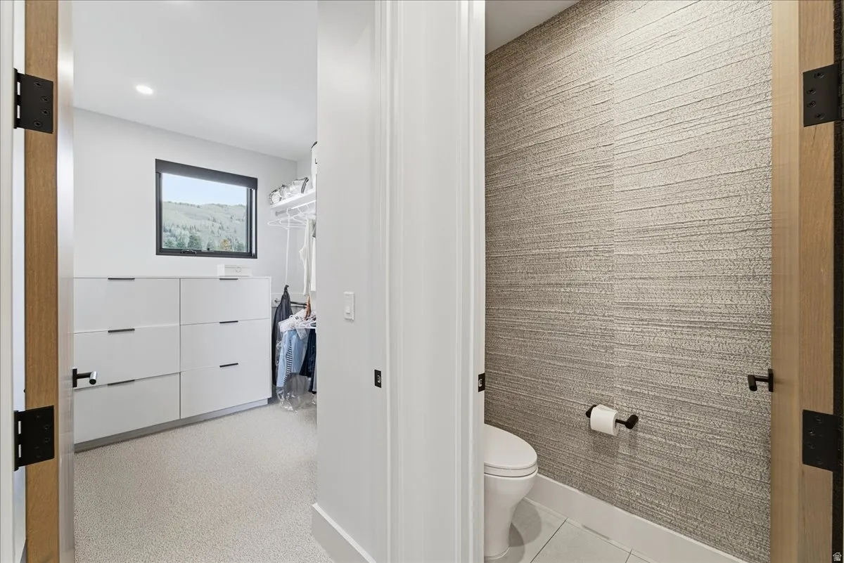Bathroom with toilet and recessed lighting