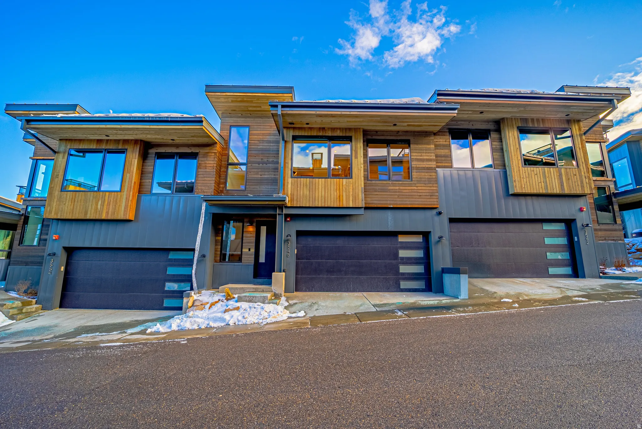 Contemporary house with an attached garage and driveway