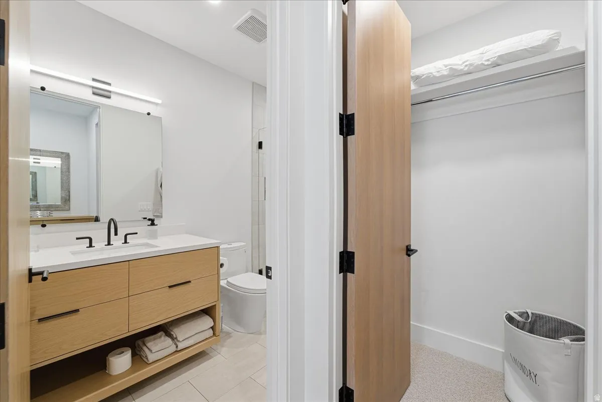 Bathroom with vanity and toilet