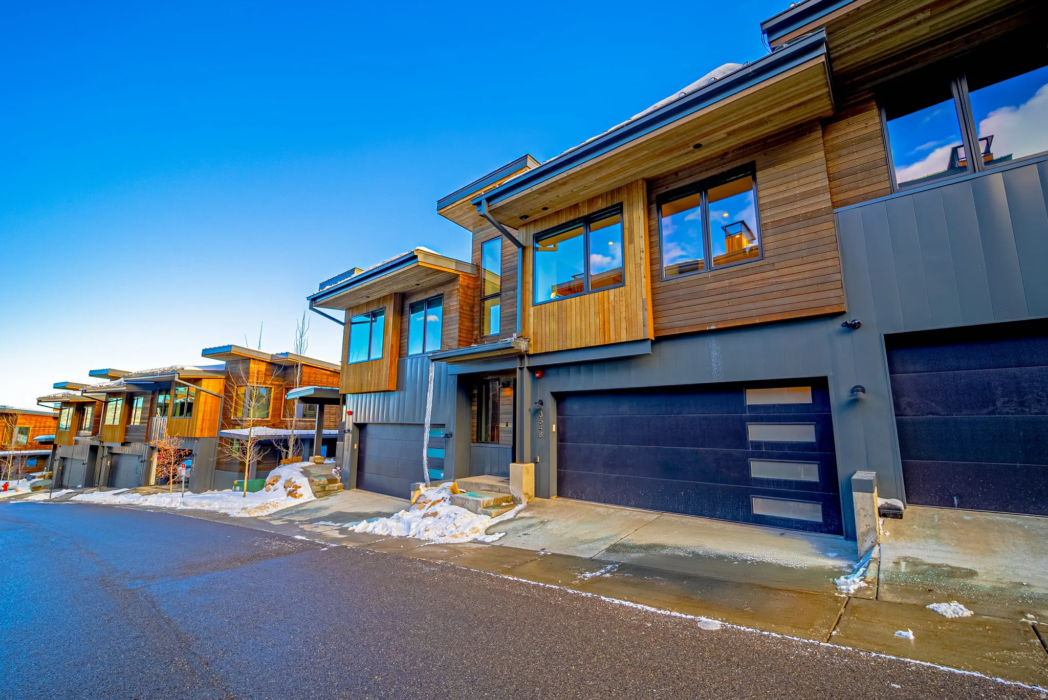 Contemporary home featuring a garage