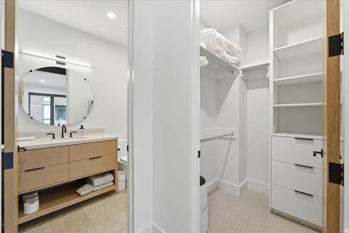 Walk in closet with a sink