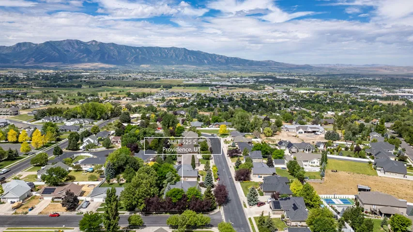 Expansive aerial perspective showcasing a residential neighborhood with established homes and mature landscaping