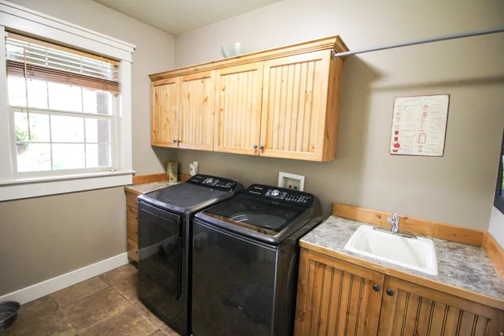 Laundry room with cabinet space and washer and dryer