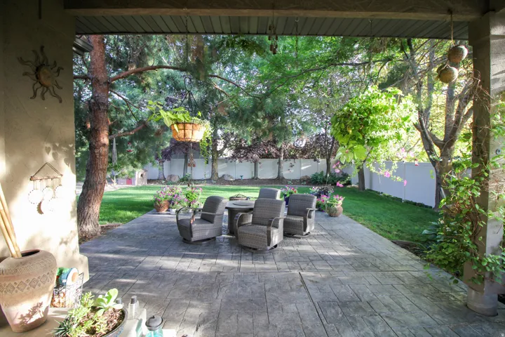 Fenced backyard with a patio area
