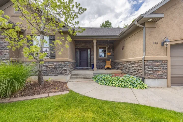 Stucco exterior with stone veneer accents